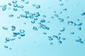 Air bubble and water splash,Water splash isolated on blue background Royalty Free Stock Photo