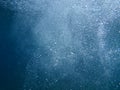 Air bubbles in blue water - underwater life off the Kastos island coast, Ionian Sea, Greece - abstract background. Royalty Free Stock Photo