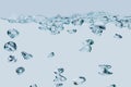 Air bubbles isolated on light blue Royalty Free Stock Photo