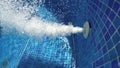 Air bubbles from jacuzzi jet in bubbly blue water in a thermal spa pool Royalty Free Stock Photo