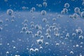 Air bubbles in a liquid. Abstract blue background Royalty Free Stock Photo