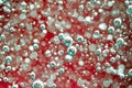 Air bubbles in a liquid. Abstract red background. Macro Royalty Free Stock Photo