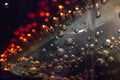 Air bubbles on a piece of ice in a liquid soda. carbonated water in a glass is close