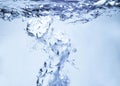 Air bubbles rising up to surface in blue pure water. Abstract background