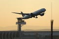 Air Canada plane taking off, ATC air traffic control tower on background Royalty Free Stock Photo