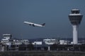 Air Canada plane taking off, ATC air traffic control tower on background Royalty Free Stock Photo