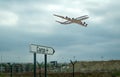 Air cargo sign on ground and a cargo flight on the air