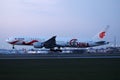 Air China airplane landing at sunset