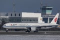 Air China plane doing taxi on Munich Airport, MUC, snow
