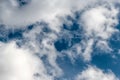 Air clouds on a dark sky. Light blue background in the air. Abstract style with place for text for design Royalty Free Stock Photo