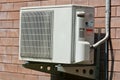 Air condition condenser unit hanging on wall Royalty Free Stock Photo