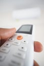 Air condition Remote control being held in a hand close up Royalty Free Stock Photo