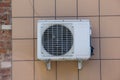 Air conditioner attached to a tiled wall