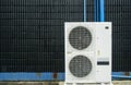 Air conditioner compressor installed in black wall building Royalty Free Stock Photo
