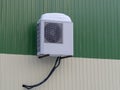 Air conditioner evaporator on the white-green wall