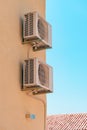 Air conditioner external unit mounted on the wall of mediterranean house in Croatia