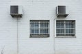 Air conditioner installed outside the building on white wall Royalty Free Stock Photo