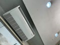 Air conditioner installed on the wall under the ceiling Royalty Free Stock Photo