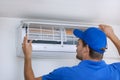 Air conditioner maintenance and repair service. hvac technician working Royalty Free Stock Photo