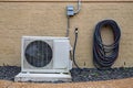 Air Conditioner mini split system next to home with brick wall Royalty Free Stock Photo