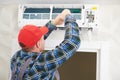 Air conditioner service. Worker at climatization system installation indoors Royalty Free Stock Photo