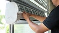 Air conditioner technician or air-conditioning installation technician is about to repair air conditioning in homes and buildings.