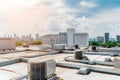 Air conditioner units HVAC on a roof of industrial building with blue sky and clouds in the background. Neural network Royalty Free Stock Photo