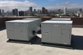 Air conditioner units HVAC on a roof of industrial building with blue sky and clouds in the background. Neural network Royalty Free Stock Photo