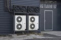 Air conditioning chiller units mounted on a frame near a building wall Royalty Free Stock Photo