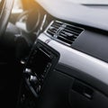 Air conditioning grill inside a car. Climate control AC unit in the new car. Royalty Free Stock Photo