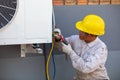 Air-conditioning installation by expert technicians in the uniform Royalty Free Stock Photo