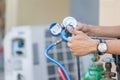 Air Conditioning Repair, repairman on the floor fixing air conditioning system Royalty Free Stock Photo