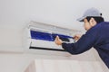 Air conditioning repairman in the blue uniform Royalty Free Stock Photo