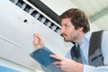 air conditioning repairman with clipboard Royalty Free Stock Photo