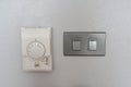 Air conditioning setting panel with light switch on the house wall Royalty Free Stock Photo
