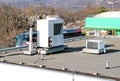 Air conditioning system assembled on top of a building / Air vents on top of commercial building / Air cooled water chillers top.