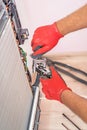 Air Conditioning Technician and A part of preparing to install. Royalty Free Stock Photo