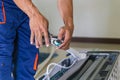 Air conditioning technicians install new air conditioners in homes, Repairman fix air conditioning systems, Male technician Royalty Free Stock Photo