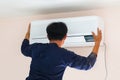 Air conditioning technicians install new air conditioners in homes, Repairman fix air conditioning systems, Male technician Royalty Free Stock Photo