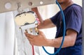 Air conditioning technicians install new air conditioners in homes, Repairman fix air conditioning systems, Male technician