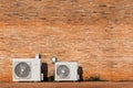 Air cooled condensers isolated on red brick wall Royalty Free Stock Photo