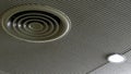 Air duct on ceiling in the mall or hospital. Air conditioner install on gypsum ceiling near ceiling lamp. Building interior