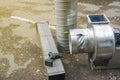 Air ducts, a radial fan and a centrifugal engine prepared for installation, foreground and background blurred with bokeh effect