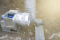 Air ducts, a radial fan and a centrifugal engine prepared for installation, foreground and background blurred with bokeh effect