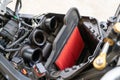 Air Filter in a sport Motorcycle. Processing to change engine air-filter. Air filters are used in applications where air quality i
