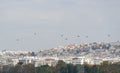 Air Force helicopters flying in formation above a city. HAF Air show in Thessaloniki, Greece during the 28 October National Oxi Royalty Free Stock Photo