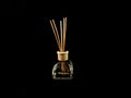 Air freshener on a black background. Incense sticks in a container with perfume. Aromatherapy canes in a glass bottle with oil Royalty Free Stock Photo