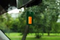 Air freshener hanging in car Royalty Free Stock Photo