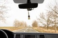 Air freshener hanging on view mirror in car