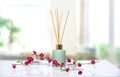 Air freshener,liquid fragrance in aroma sticks on table.Home scent,aroma therapy
